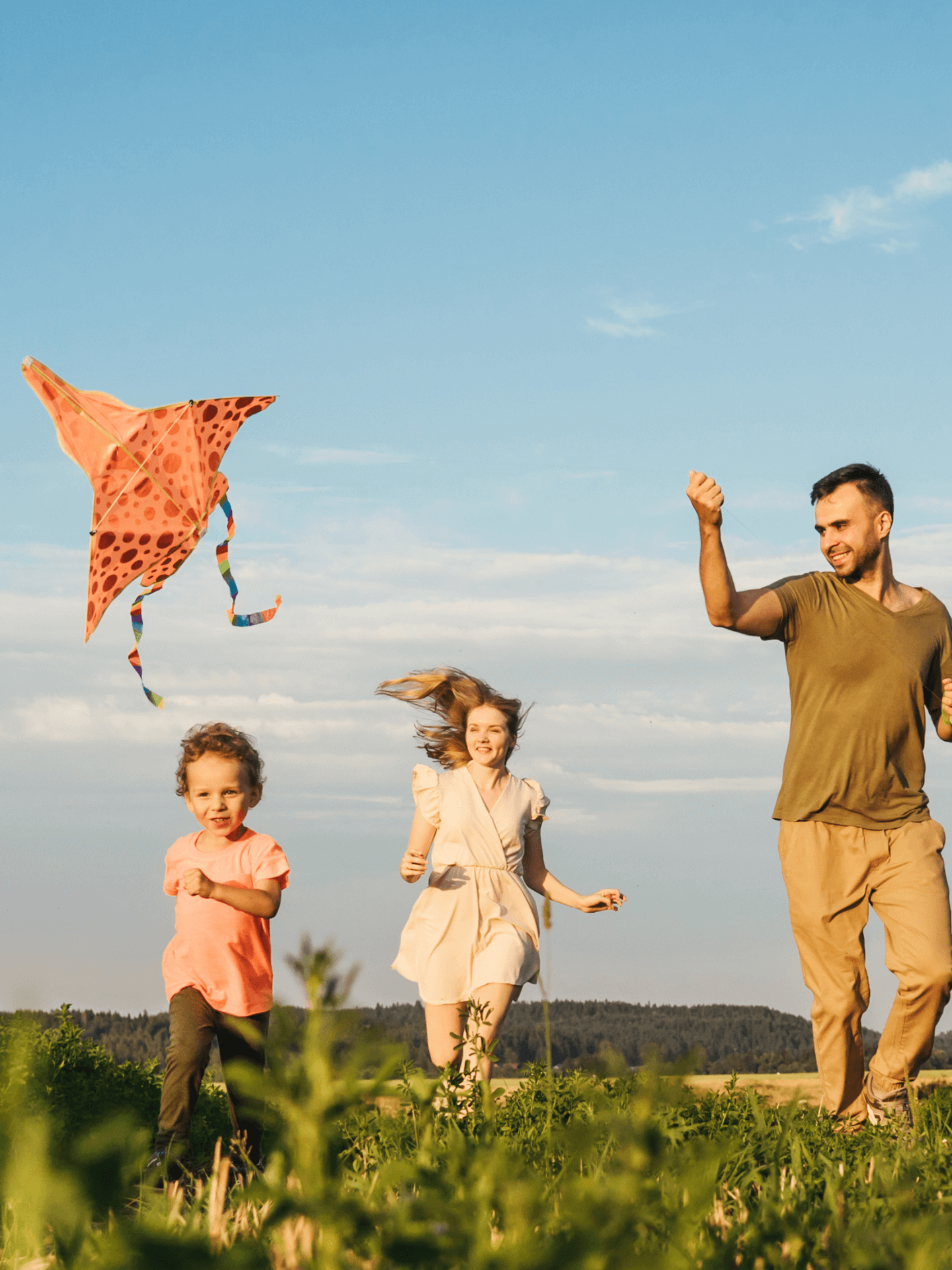 family feeling at ease in the field of their dream home 